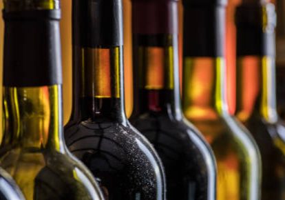 Line of wine bottles. Close-up.